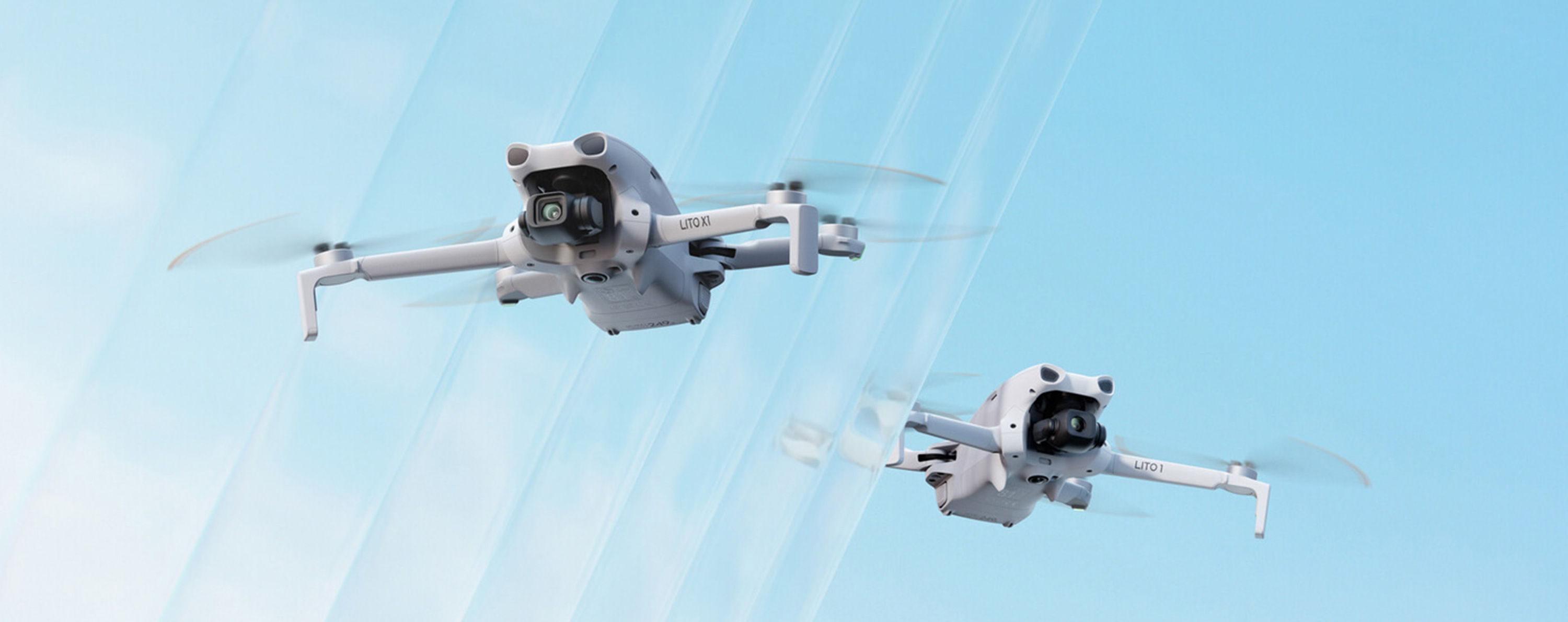 Two DJI Lito series drones flying in a clear blue sky with a glass barrier covering the left half of the image.