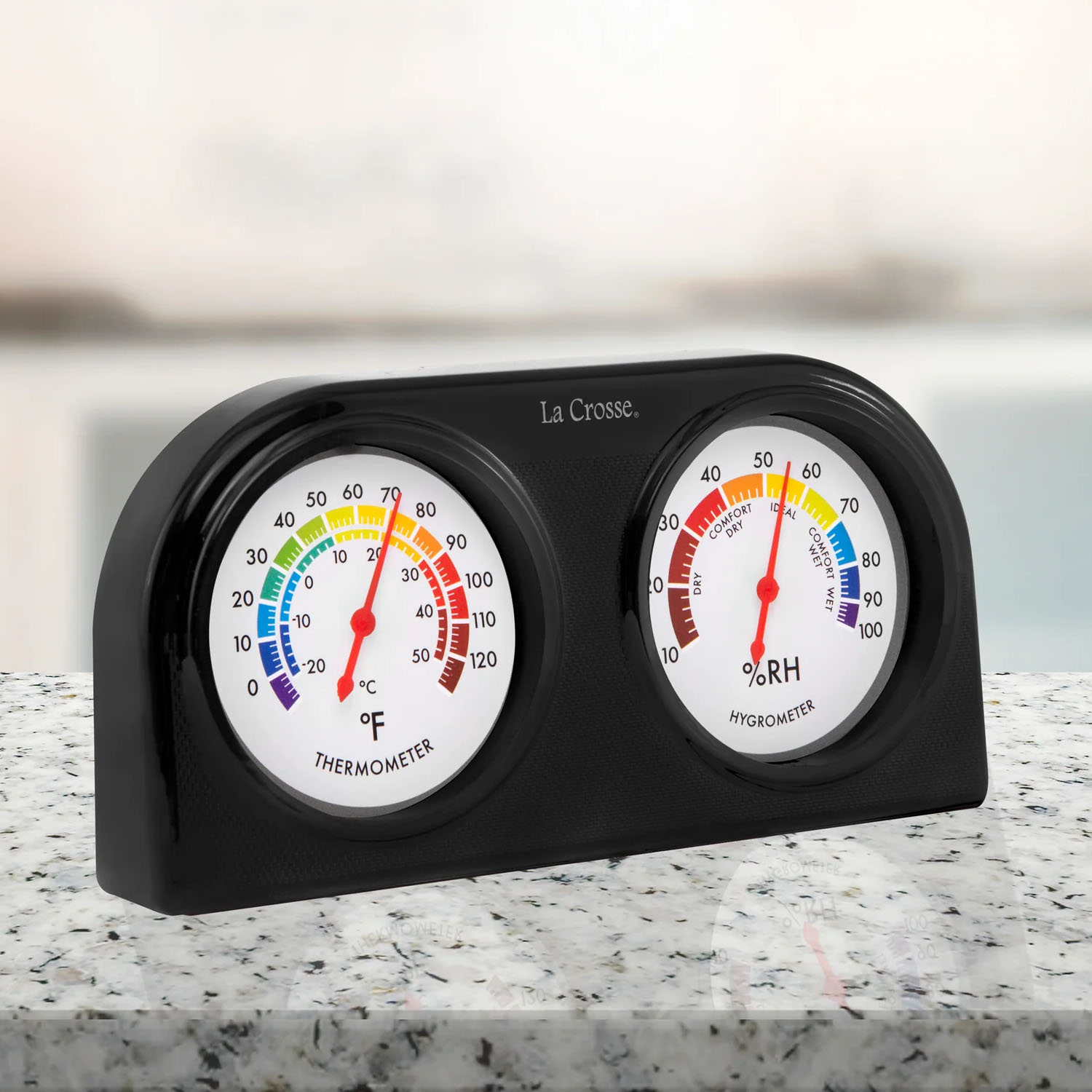 104-288 black dual dial thermometer and hygrometer on a countertop.