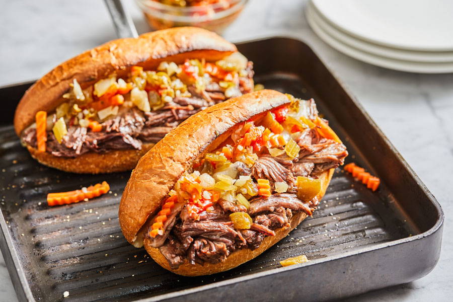 Italian beef sandwich on a toasted roll served on a cast iron plate