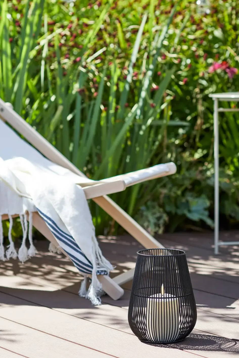 Deck chair with black lantern and LED candle