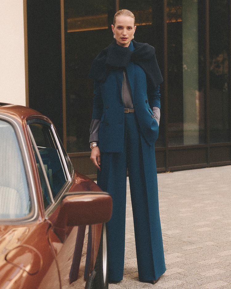 Model wearing teal suiting