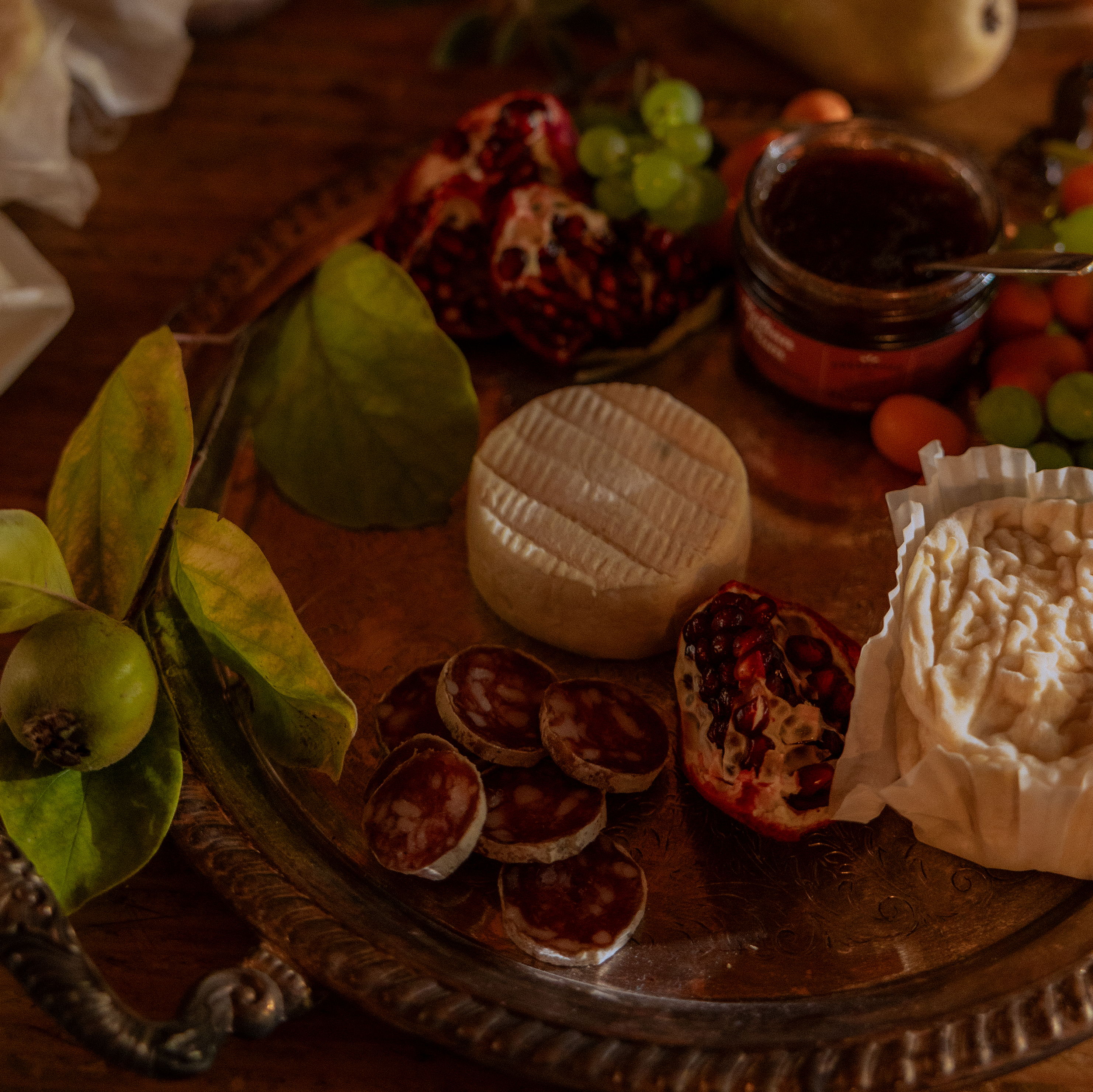 Cheese board with preserves, fruit paste and crackers