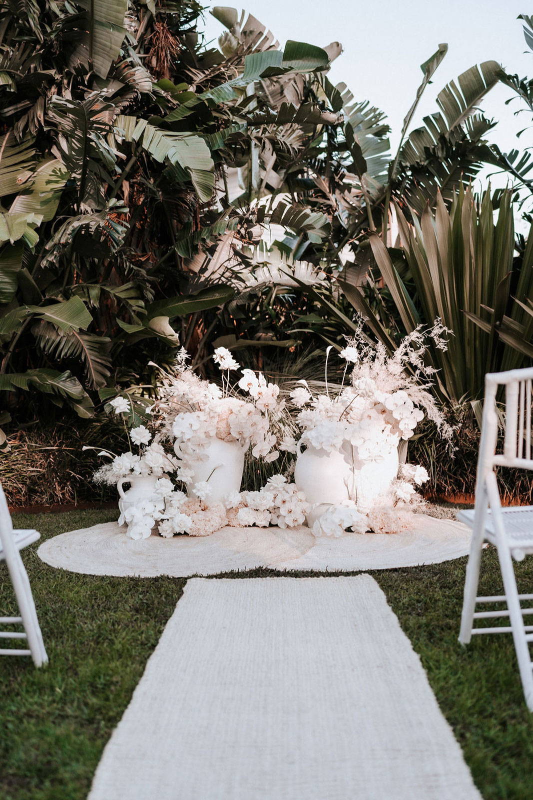 Floral arrangements at the front of the wedding ceremony