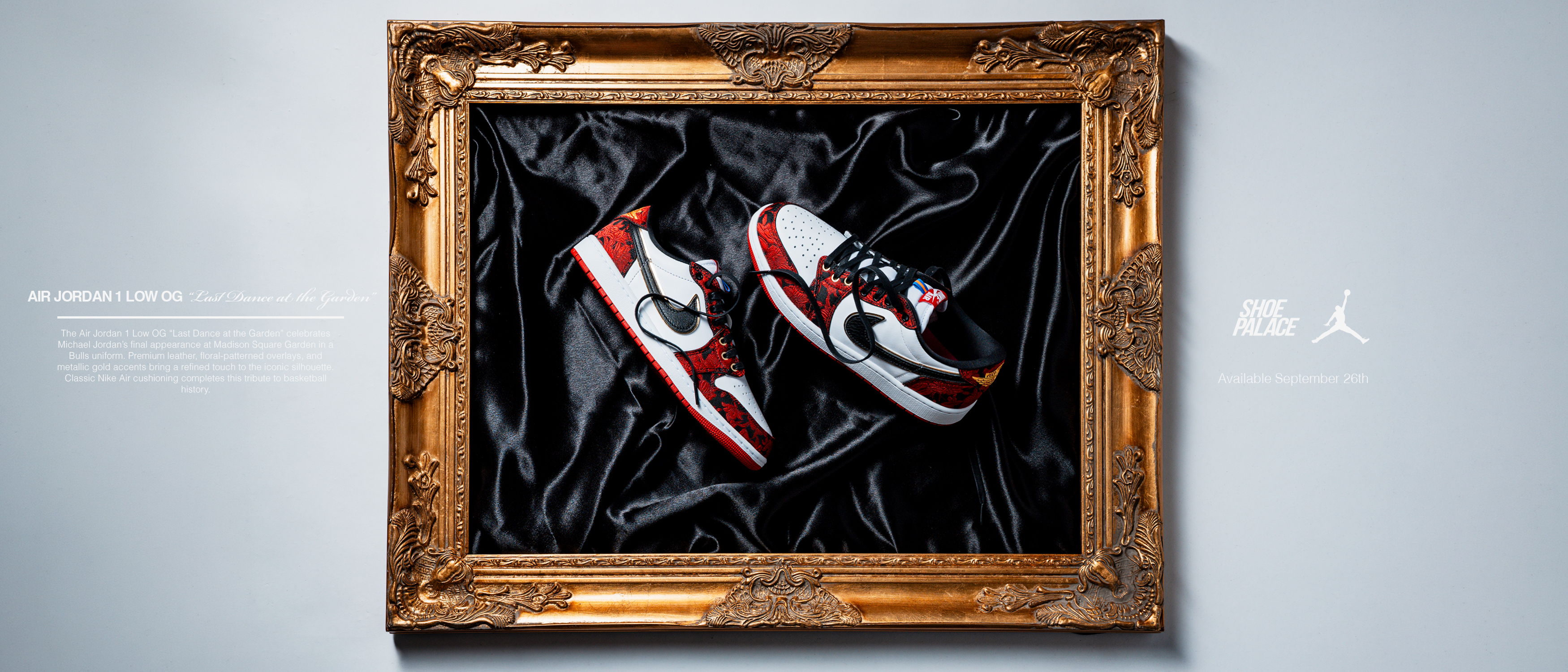 A pair of red and white sneakers displayed in a decorative frame.