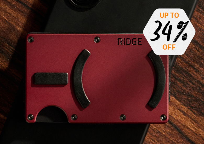 Red wallet on a wooden surface with discount tag.