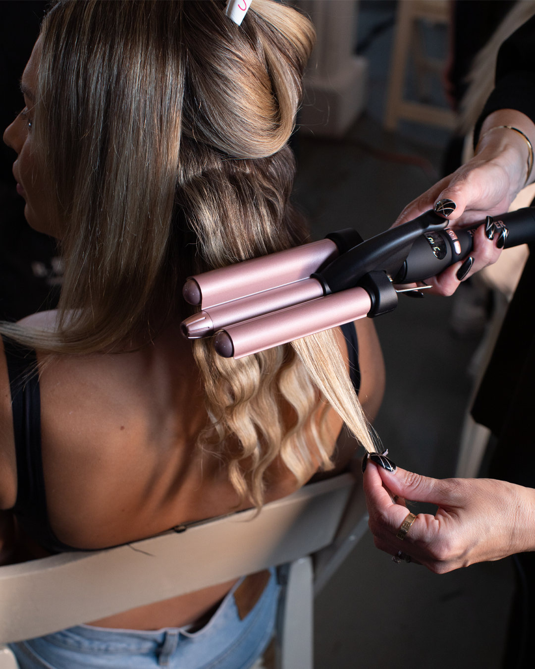 Image of Blonde hair being styled by the 3B waver 
