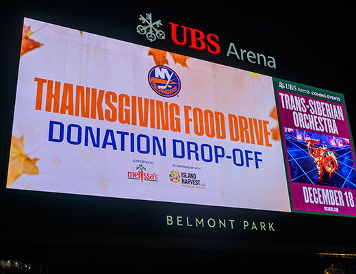 Thanksgiving Food Drive donation drop-off sign at UBS Arena.