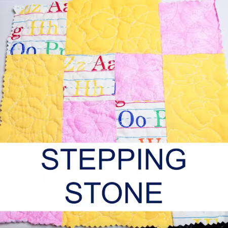 stepping stone quilt block with yellow, pink and alphabet fabric
