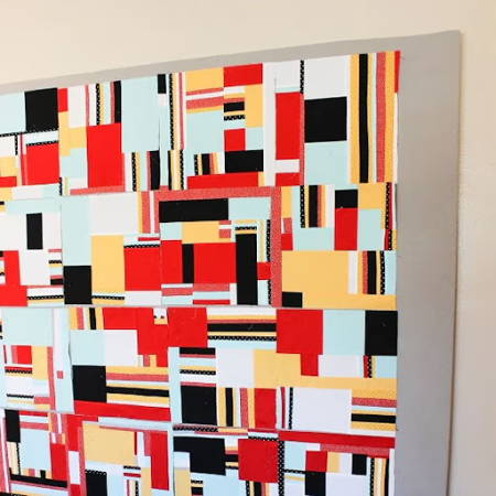 A diy quilt design wall with colorful quilt blocks attached to it