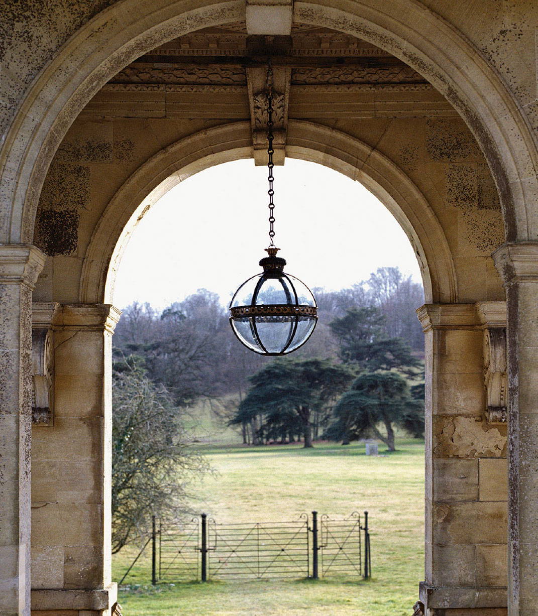 a magificent outdoors globe light, the english countryside in the background