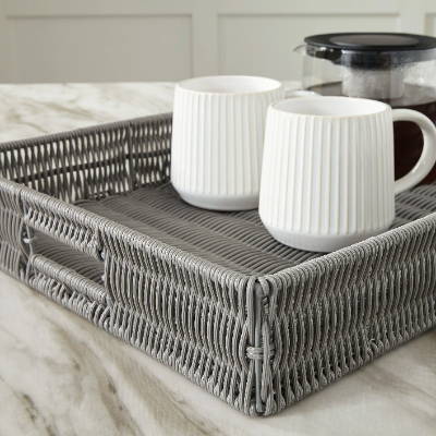 A serving tray with a pair of cups