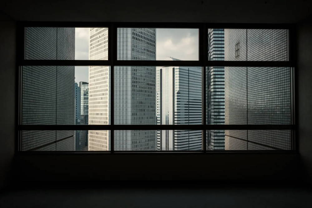 View of high-rise buildings through a glass window