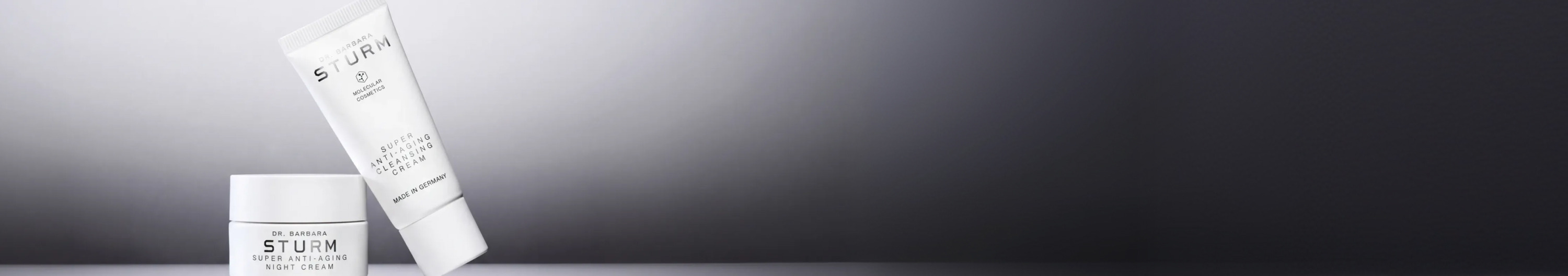 Two skincare products positioned against a gradient background.