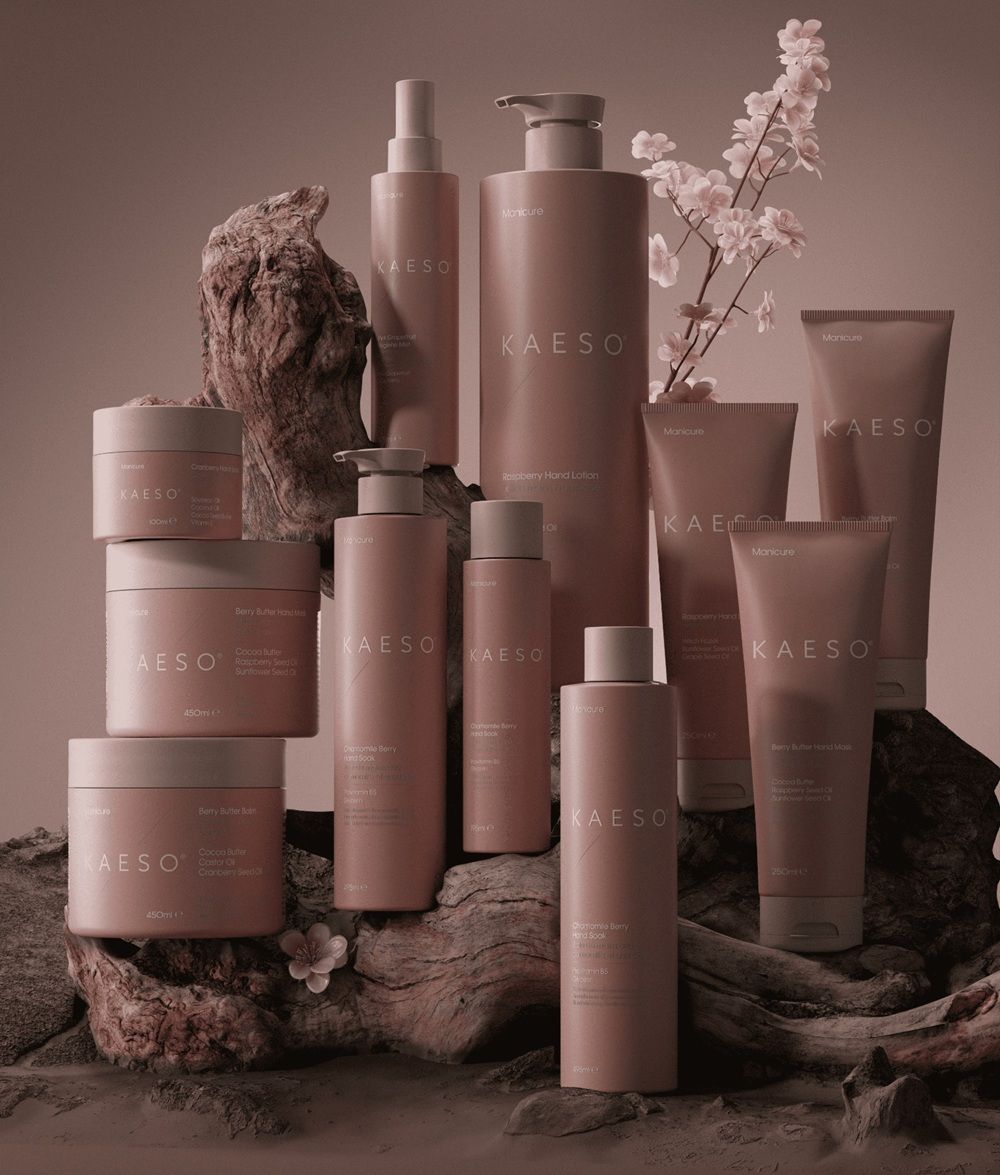 A collection of KAESO skincare products arranged artistically on a wooden surface.