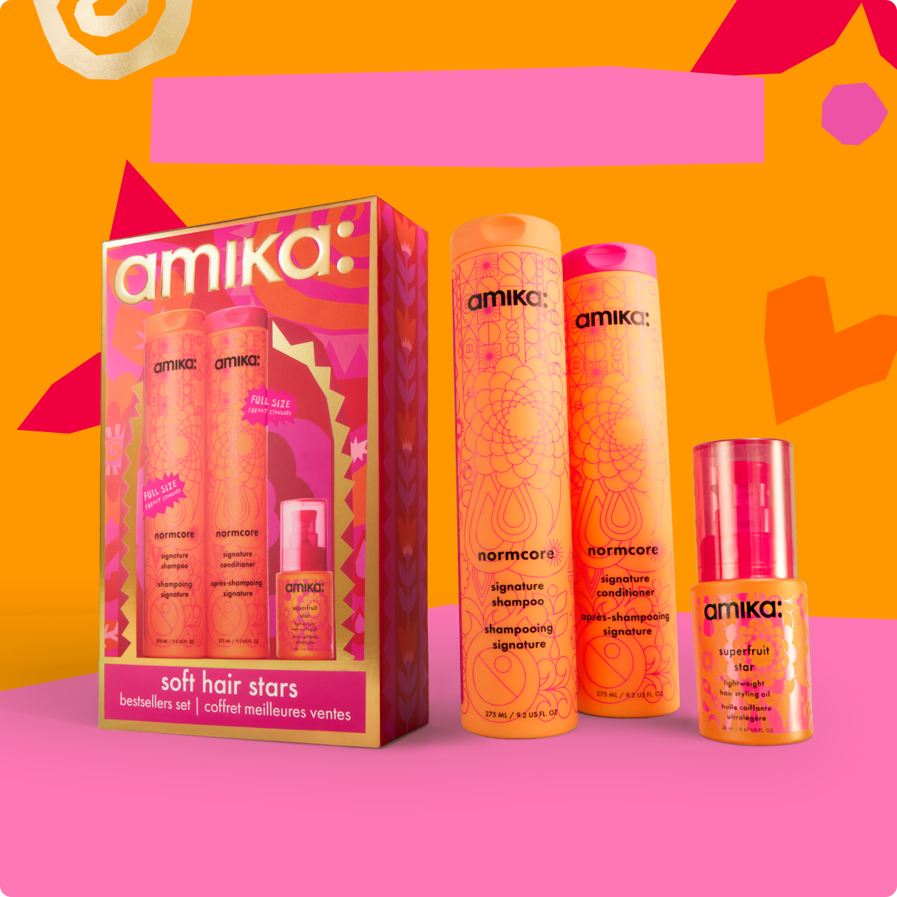 Amika hair care product set on a colorful background.