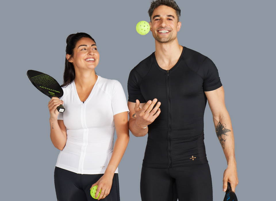 Men and women wearing Tommie Copper compression