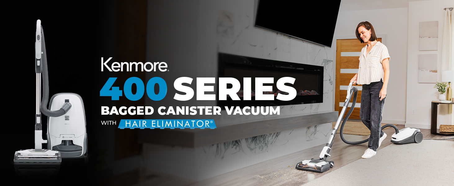Woman using Kenmore 400 Series bagged canister vacuum in a modern home.