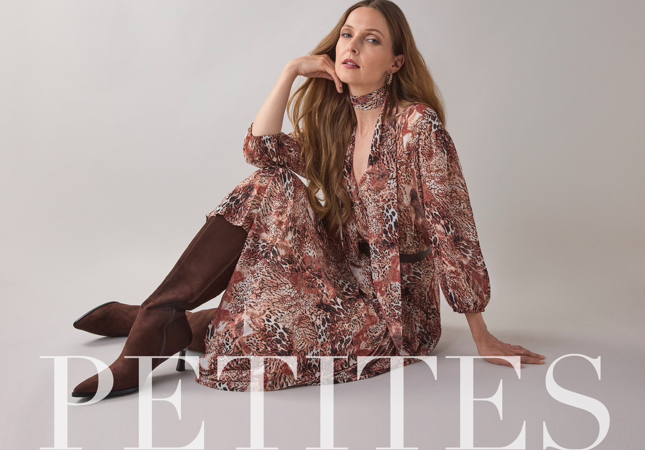 Model in floral dress posing with text 