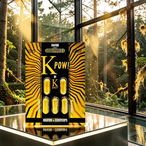 Packaging of K Pow! energy capsules in a forest setting.