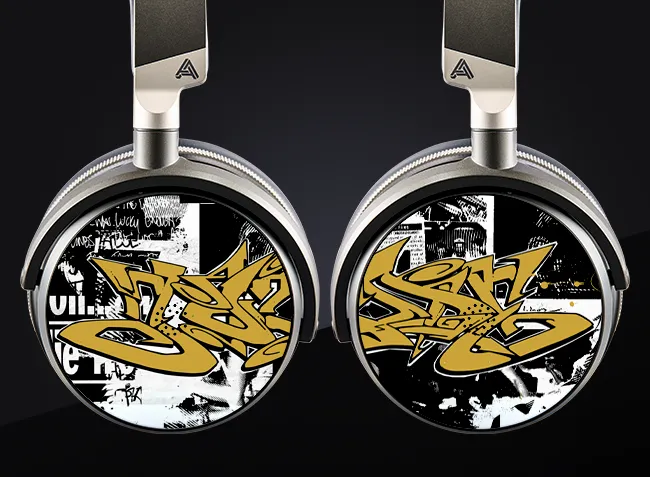 Headphones with graffiti-style artwork on the ear cups.