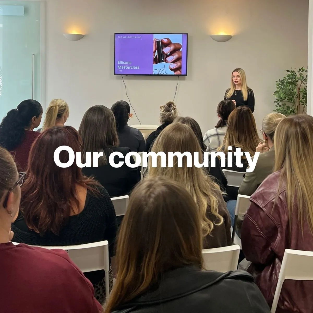 A woman speaking to an audience in a community setting.