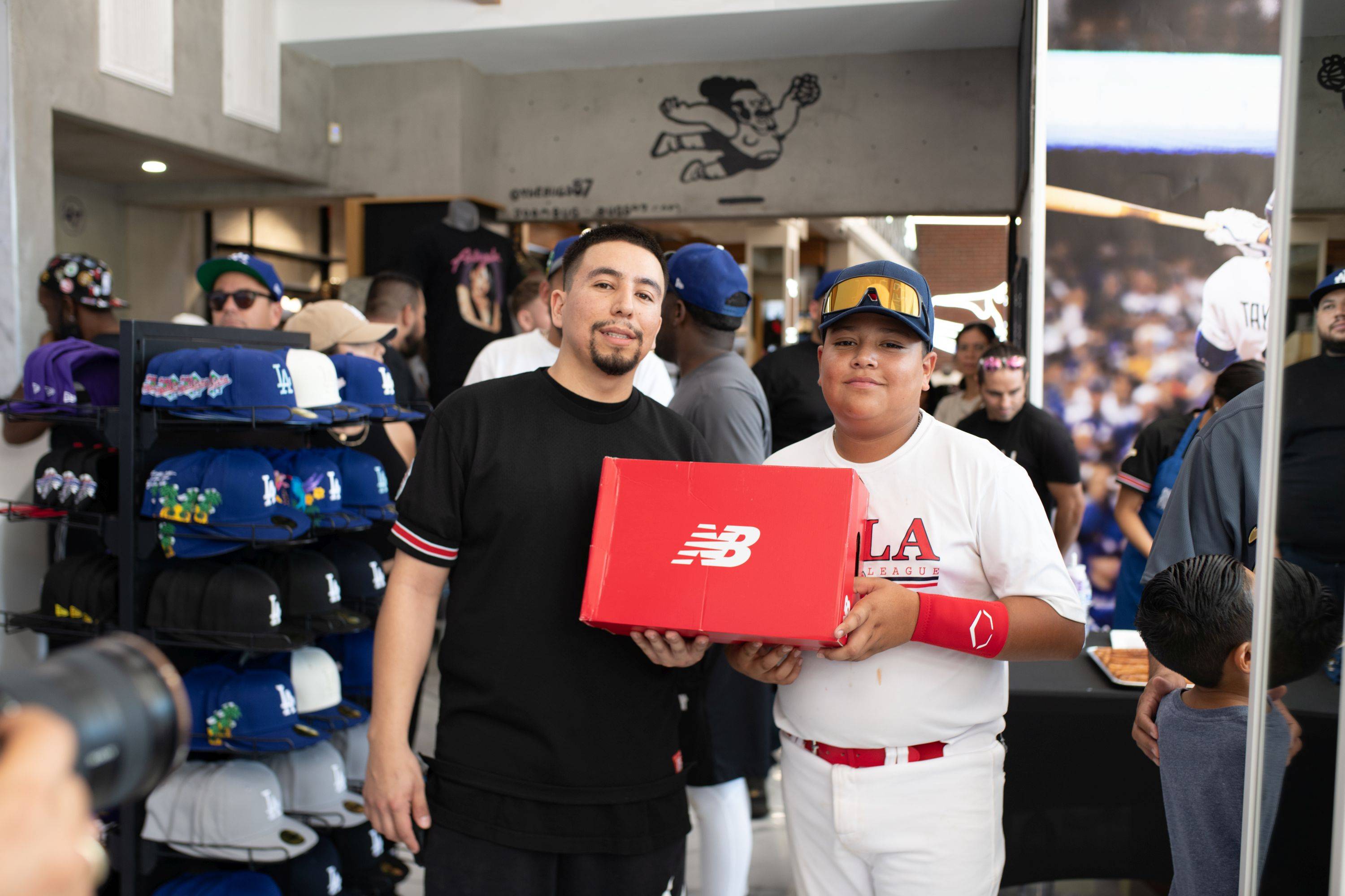 kid holding red new balance box