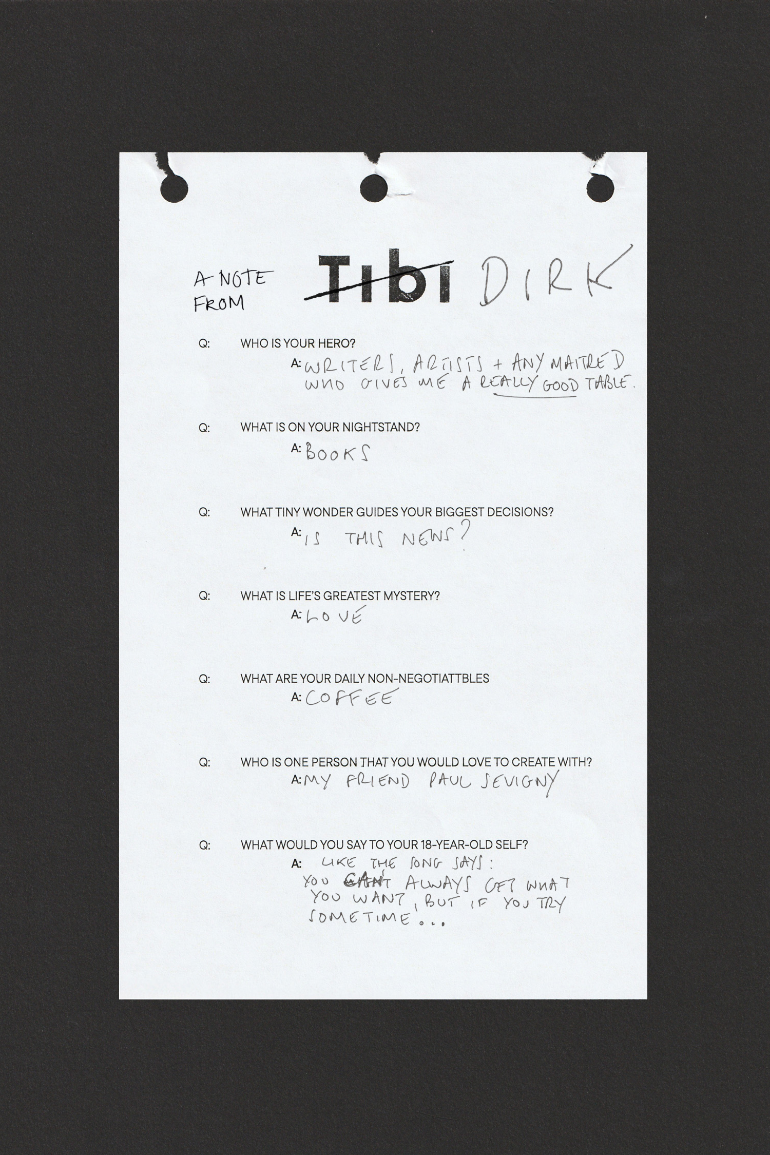 A handwritten note on white paper with questions and answers.