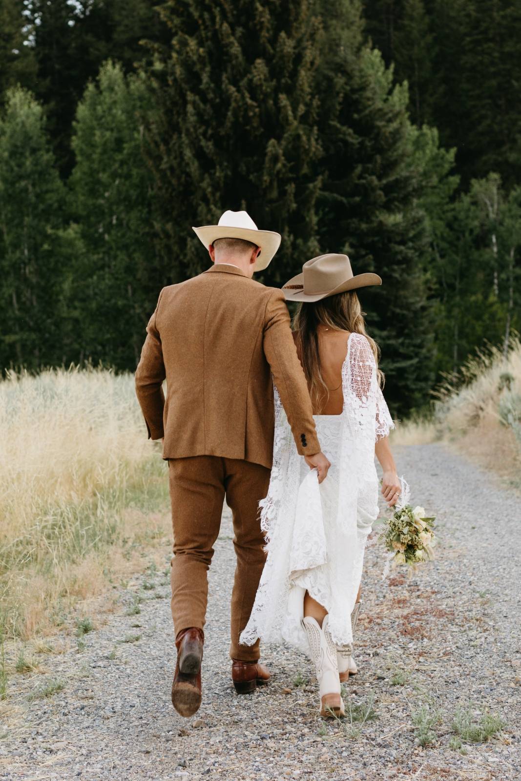 Bride and Groom in Country Hats on their Wedding Day