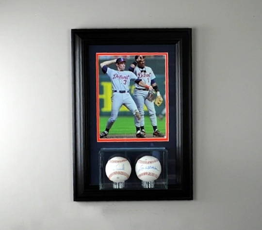 A baseball memorabilia case with a player photo.
