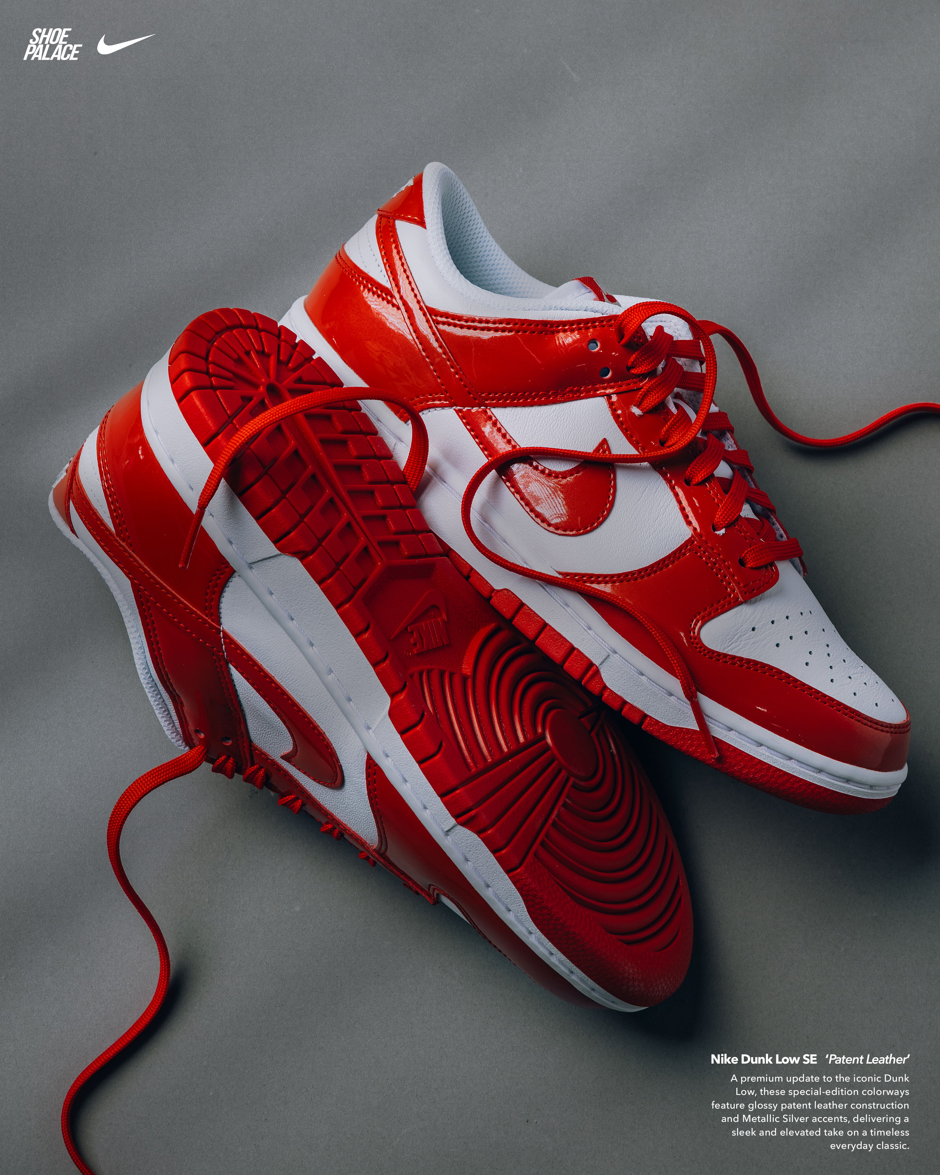 Red and white Nike sneakers on a gray background.