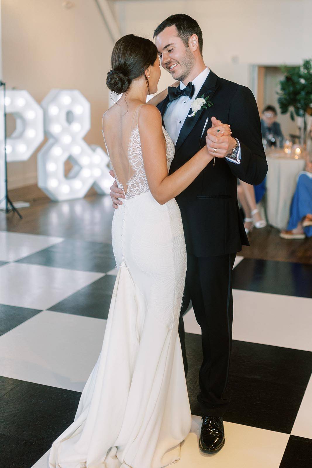 Close up of the bride and groom as they dance together