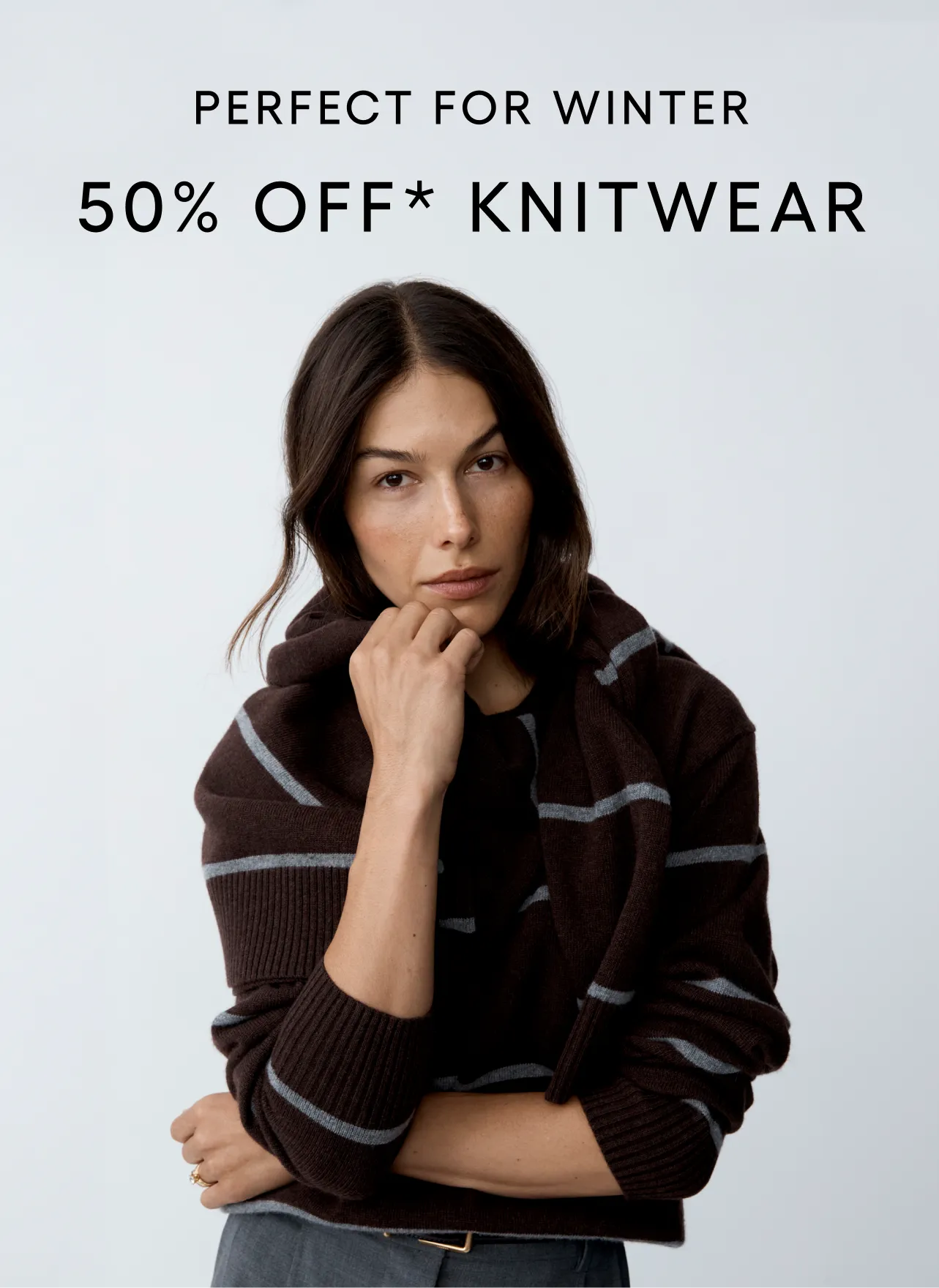 Model in knitwear promoting a winter sale with text overlay.
