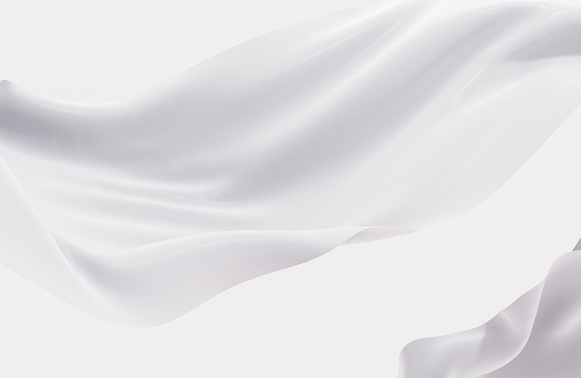 Flowing white fabric on a light background.