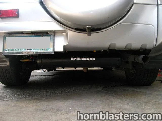 Rear low-angle HornBlasters air tank mounted under bumper spare tire carrier Raymond's Toyota RAV4 844K gallery photo 9