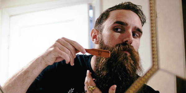 zeus model brushing beard
