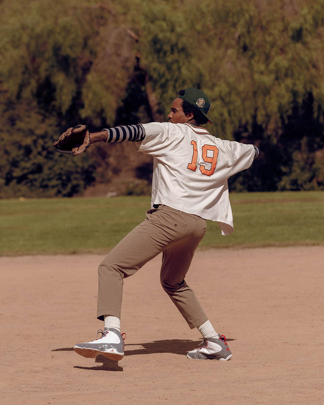 male model winding up to pitch in aj9 retro fire red