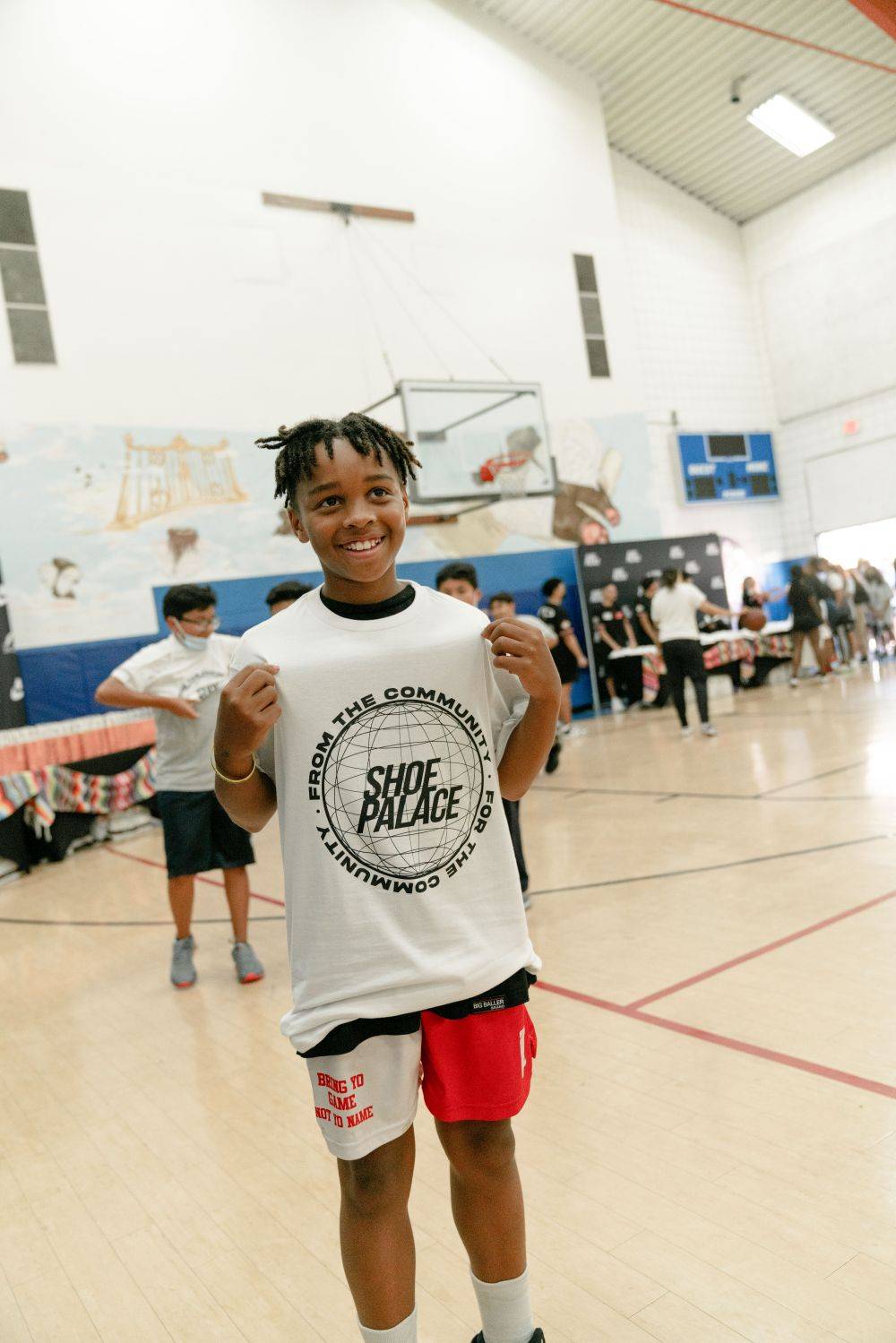 kid showing of sp shirt
