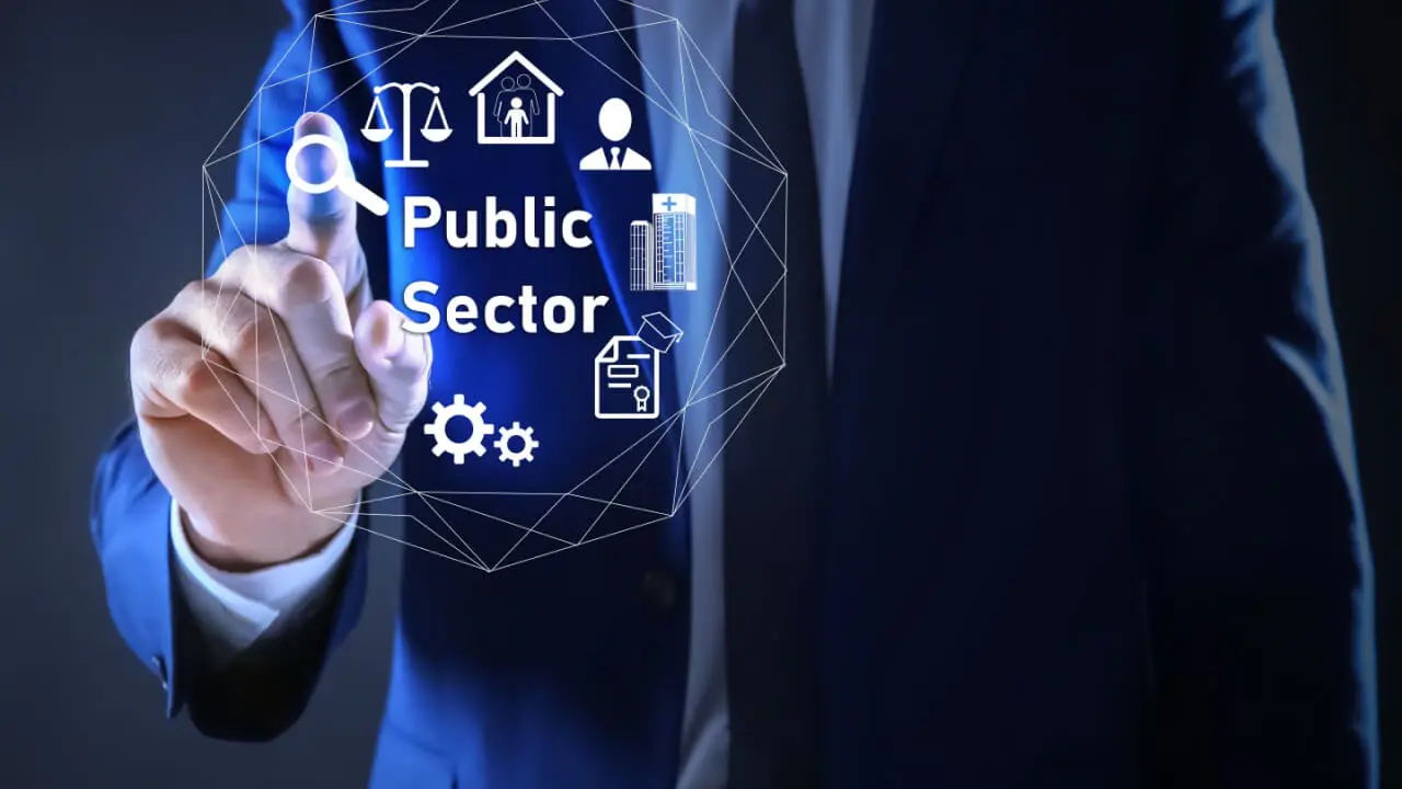 Businessman interacting with digital icons related to the public sector.
