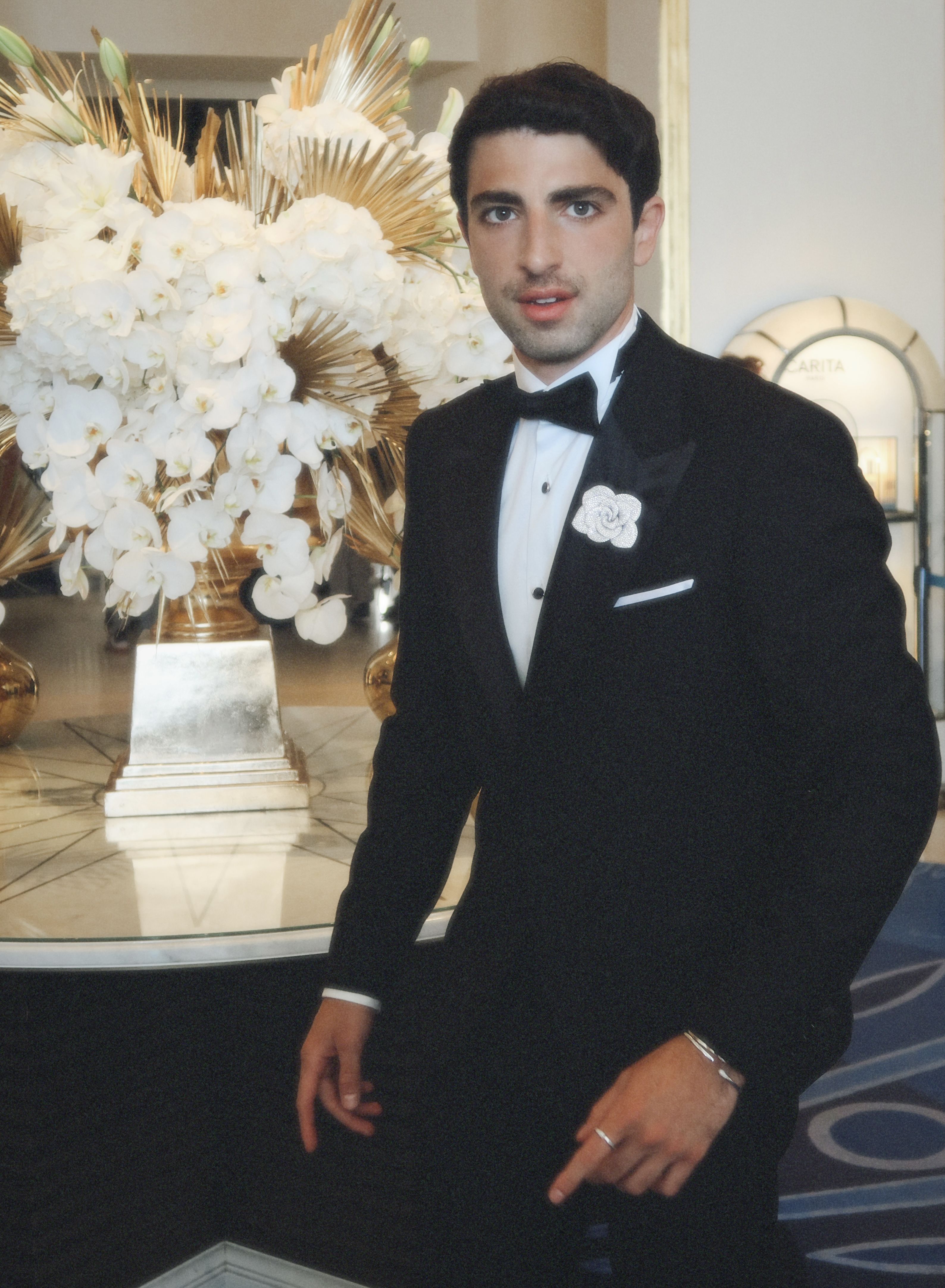 Bader wearing the Rosina brooch in 18k white gold with diamonds and Accendimi collection