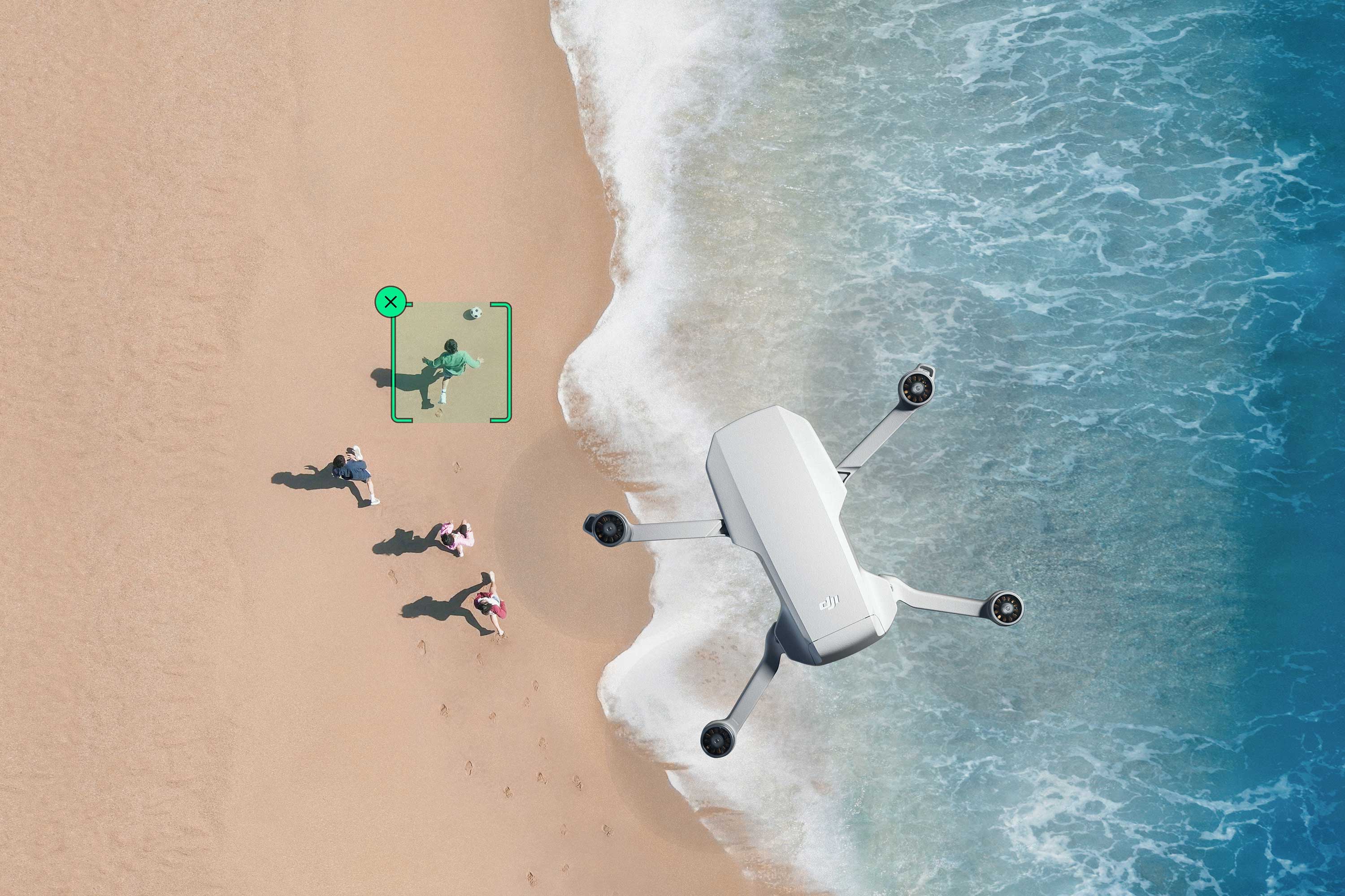 Aerial view of a DJI Mini 4K drone near people on a beach.