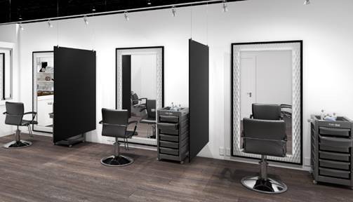 Hanging barrier partitions in a salon between chairs