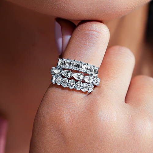 women wearing multiple lab grown diamond fashion rings in different diamond shapes