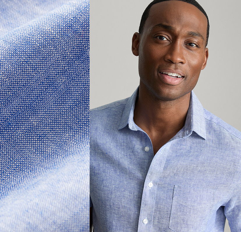 Man wearing a light blue shirt with a fabric swatch beside him.