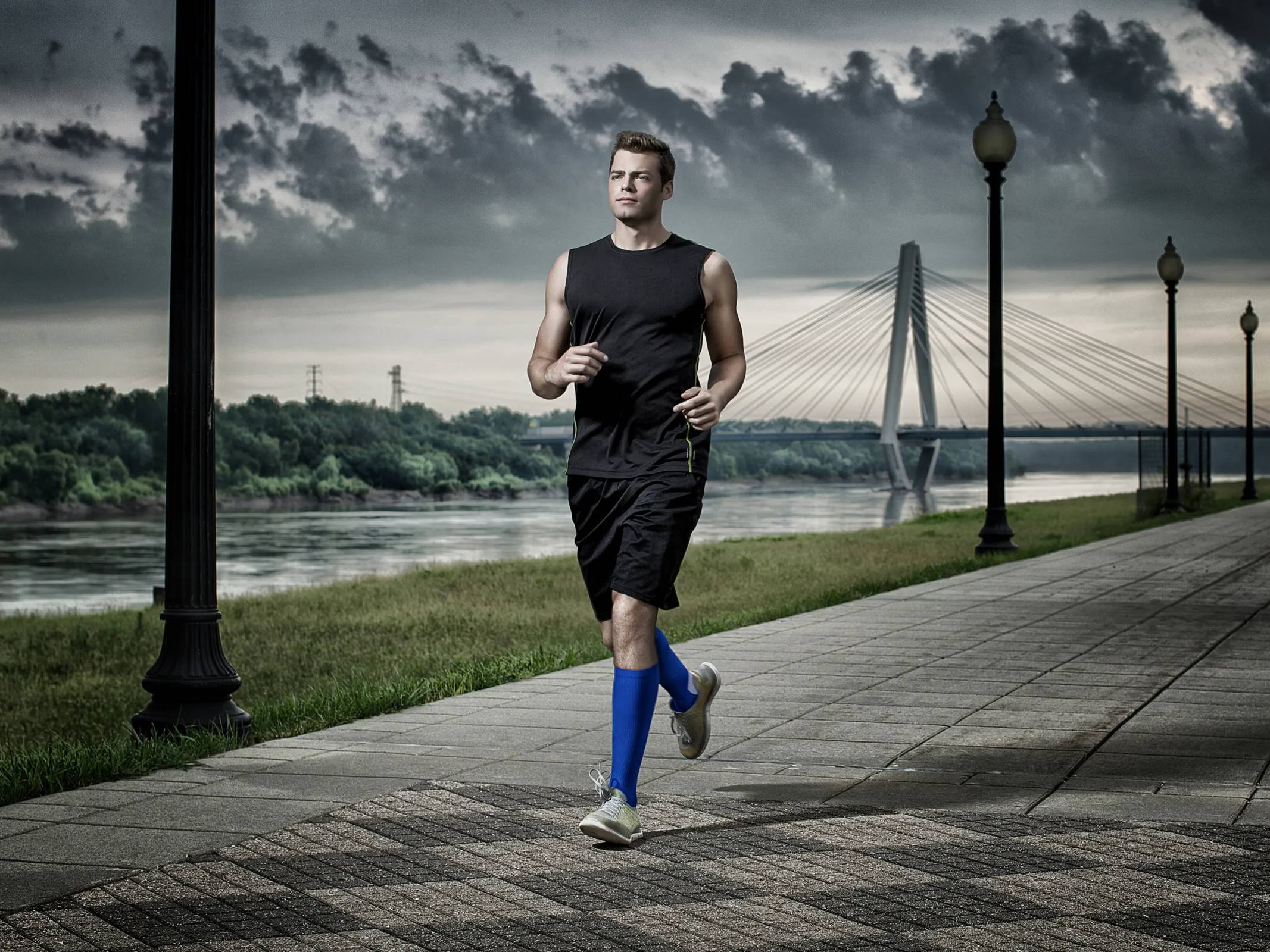 Male running outdoors wearing TheraSport Athletic Compression Socks
