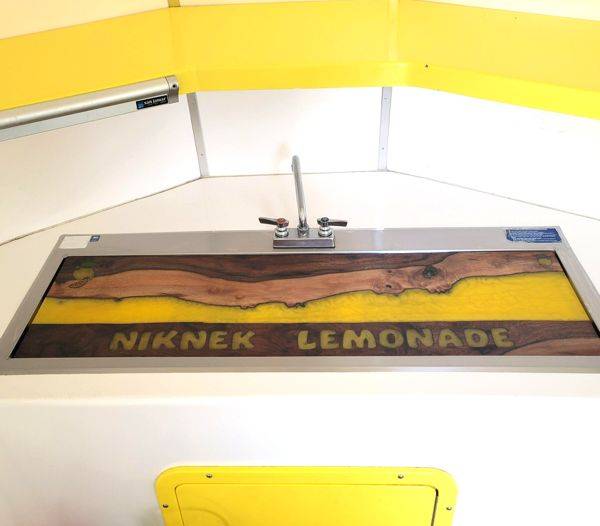 An epoxy sink cover for a lemonade stand, made using UltraClear Bar & Table Top Epoxy