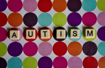 Colorful polka dot background with letter blocks spelling 
