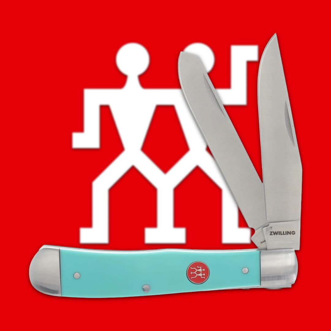 A folding knife with two blades against a red background.