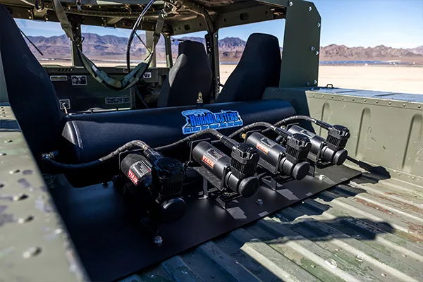 Rear bed HornBlasters air tank four VIAIR compressors braided hoses roll cage desert mountains Prodigy TV Warship KM-110 onboard air gallery photo 5