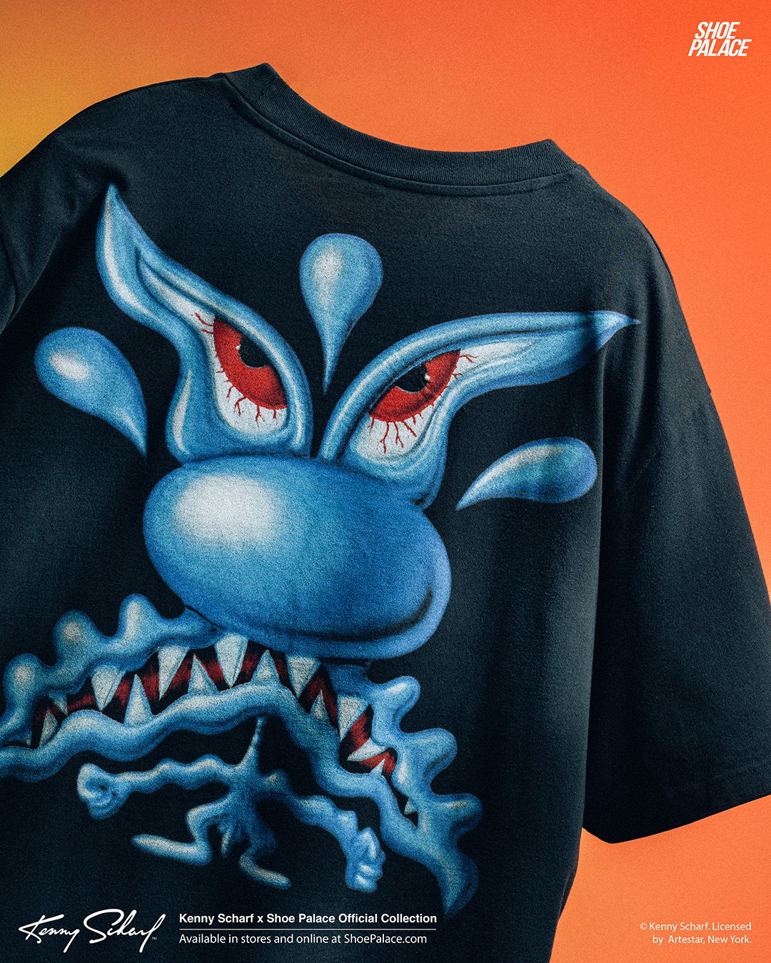 Black t-shirt featuring a blue and red monster graphic on the back.