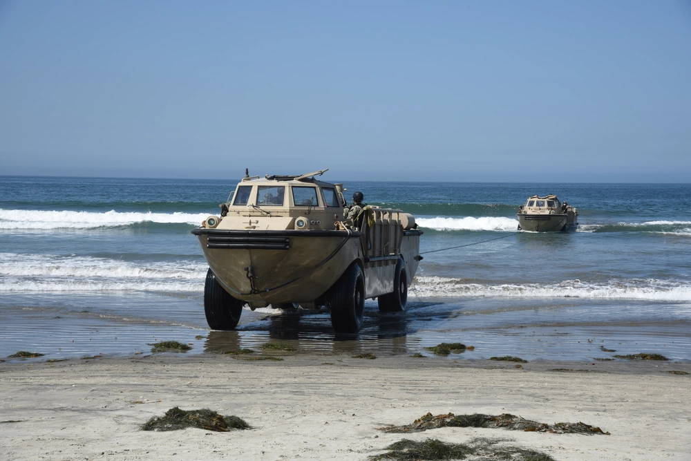 A Lighter Amphibious Resupply Cargo (LARC) vehicle tows a second LARC at the Silver Strand Training Complex in Coronado, Calif., during Professional Training of Midshipmen (PROTRAMID) Surface Week, Aug. 12. PROTRAMID is an eight-week program during the summer months that provides in-depth training to midshipmen on the various communities within the Navy and Marine Corps.